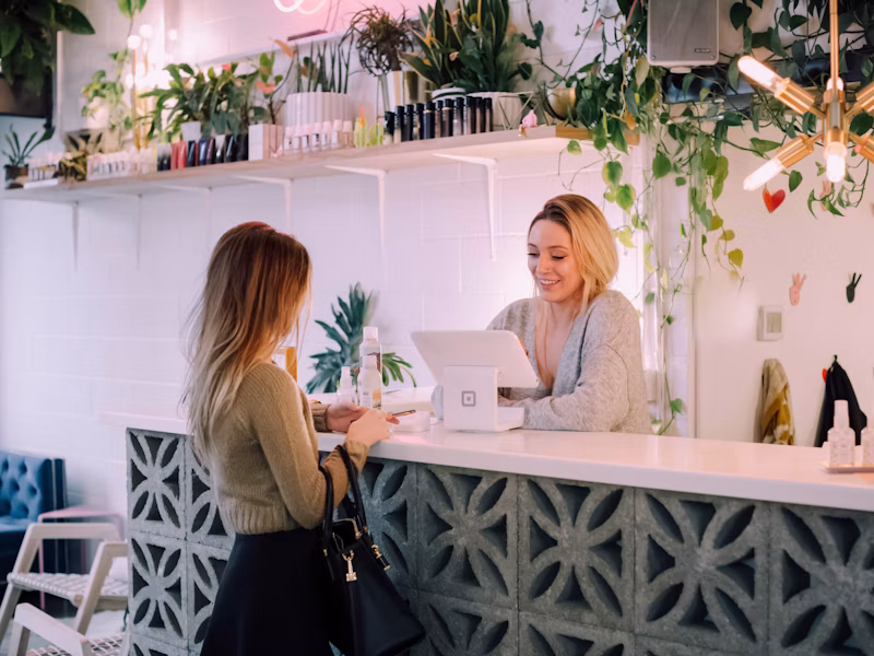 Customer paying with card while merchant receives payment on phone